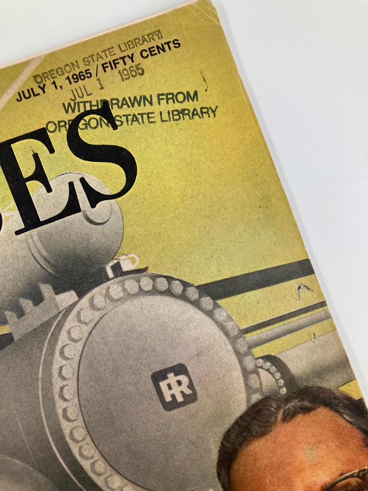 Detail of the side of the cover of VTG Forbes Magazine July 1, 1985, showcasing the publication's information, including dates and library markings.