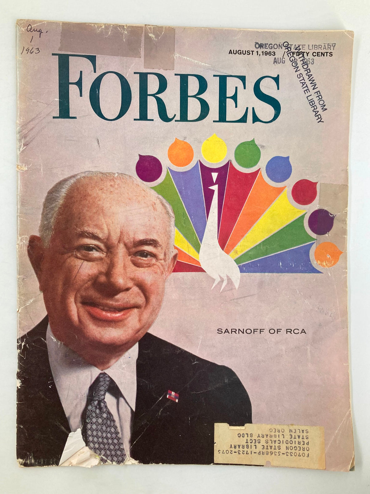 VTG Forbes Magazine October 1 1963 cover featuring David Sarnoff of RCA with colorful design elements, showing signs of wear including creases and a torn corner.
