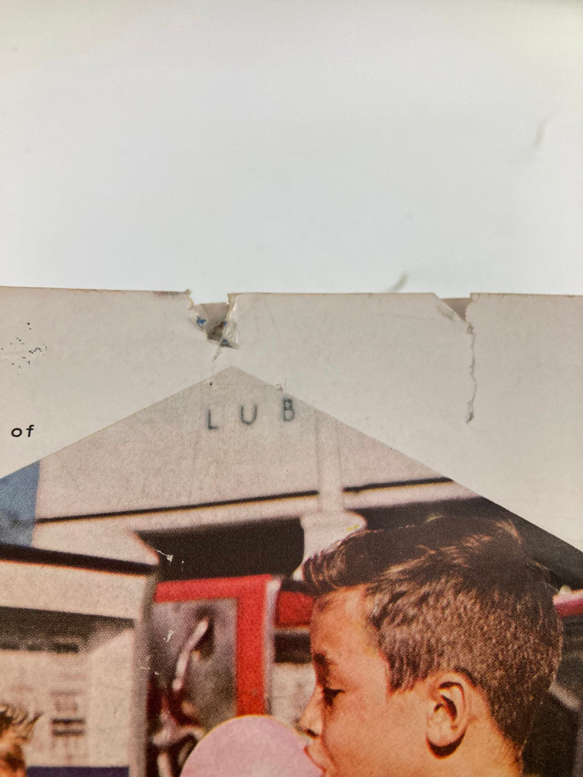 Close-up image highlighting edge wear and minor damage on the back cover of VTG Forbes Magazine from February 15, 1963, reflecting its historical significance.