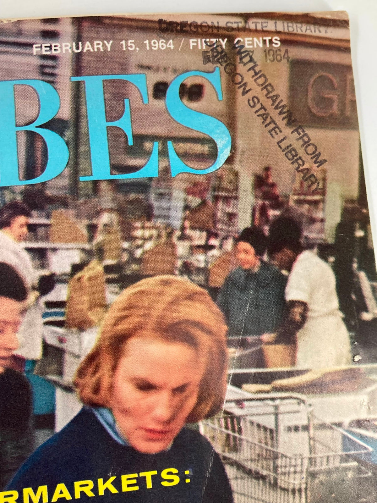 Close-up of the VTG Forbes Magazine February 15 1964 cover, showing the magazine title and a detail of the supermarket scene, emphasizing the 'Profit Squeeze' theme.
