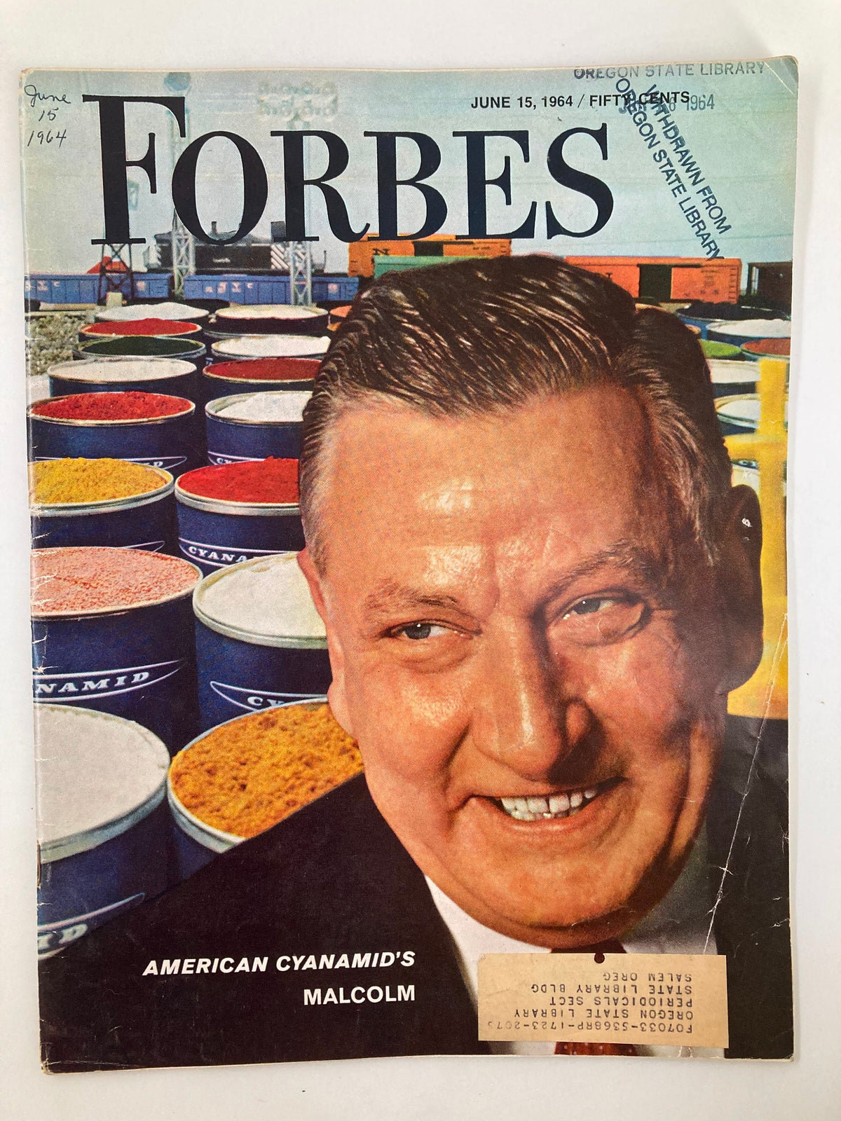Cover of VTG Forbes Magazine June 15, 1964 featuring American Cyanamid's Malcolm with a colorful background of barrels and containers.