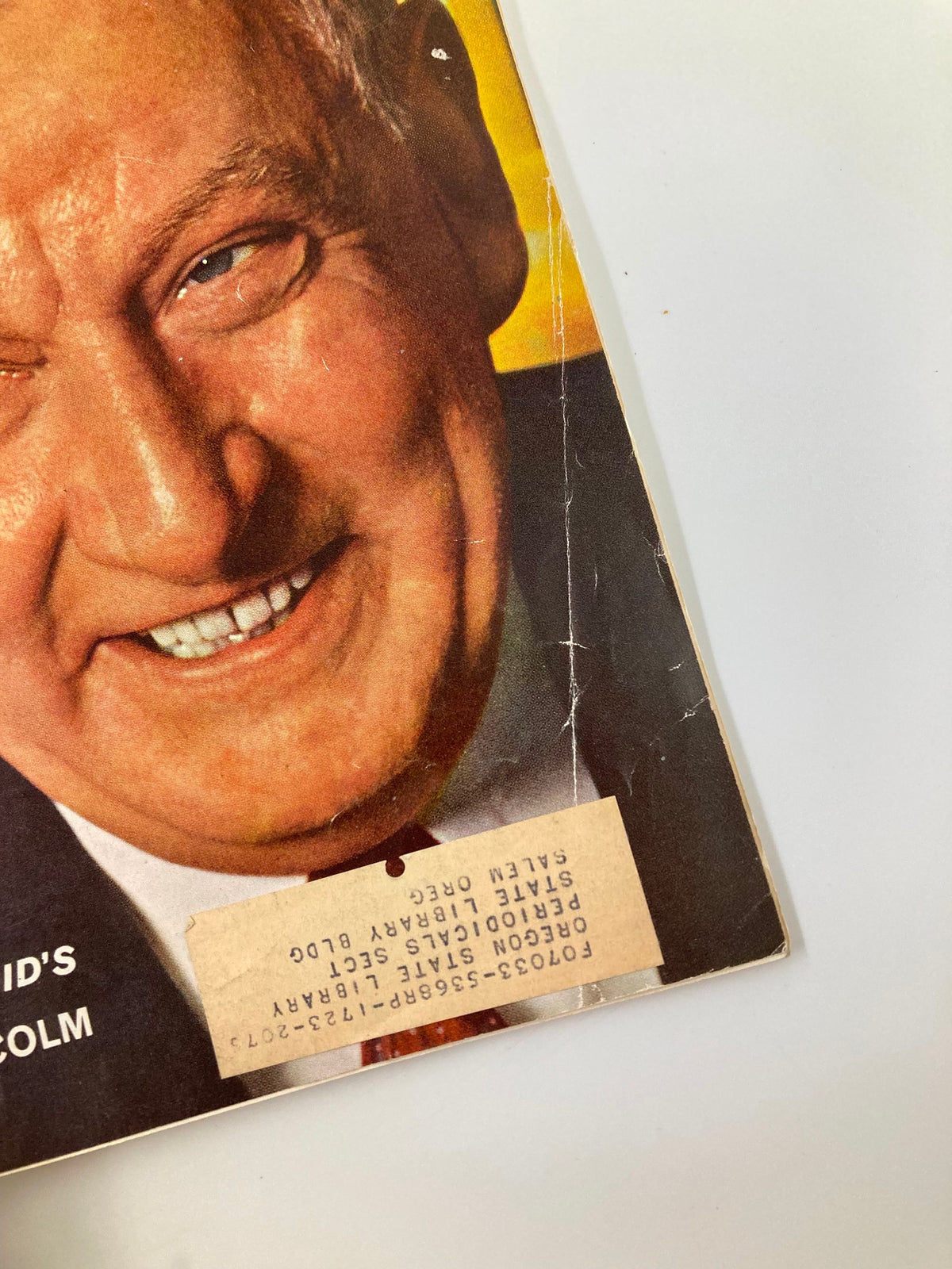 Close-up of the lower cover of VTG Forbes Magazine June 15, 1964 with a label showing withdrawal from the Oregon State Library and the image of American Cyanamid's Malcolm.