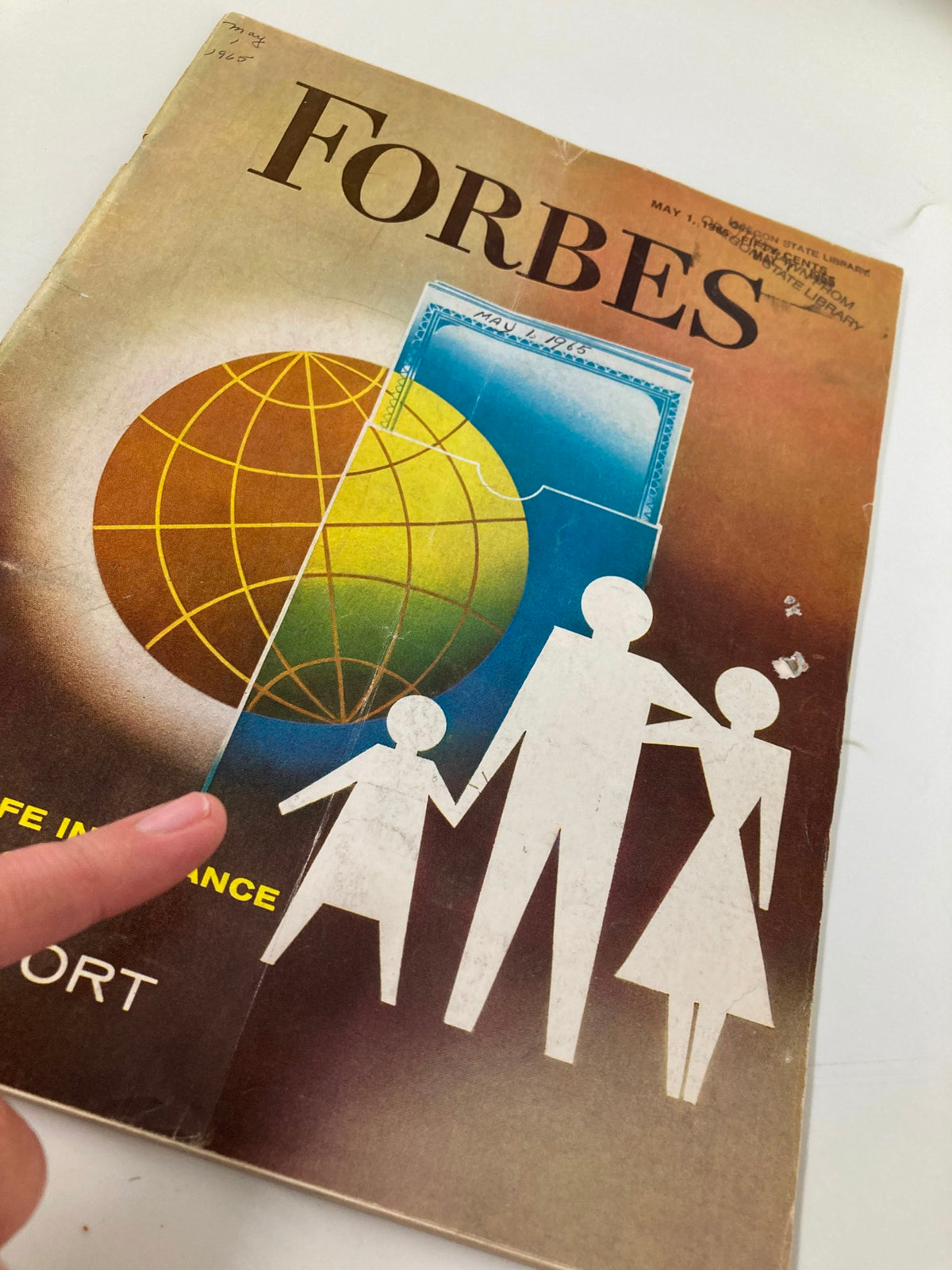 Close-up of the cover of VTG Forbes Magazine May 1 1965, emphasizing the family illustration and the title 'Forty Stock Life Insurance Companies Report'. Includes wear details and library markings.