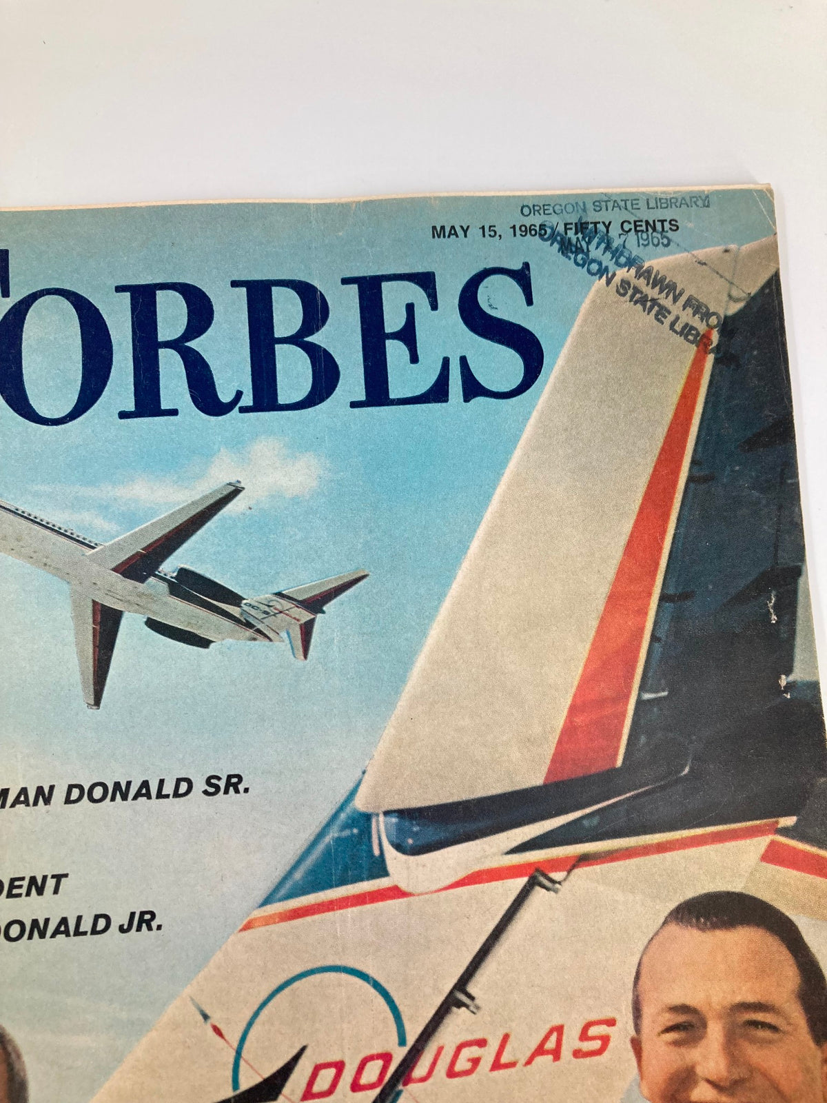 Close-up of the cover of VTG Forbes Magazine May 15 1965 showcasing the title and photographs of Chairman Donald Sr. and President Donald Jr.