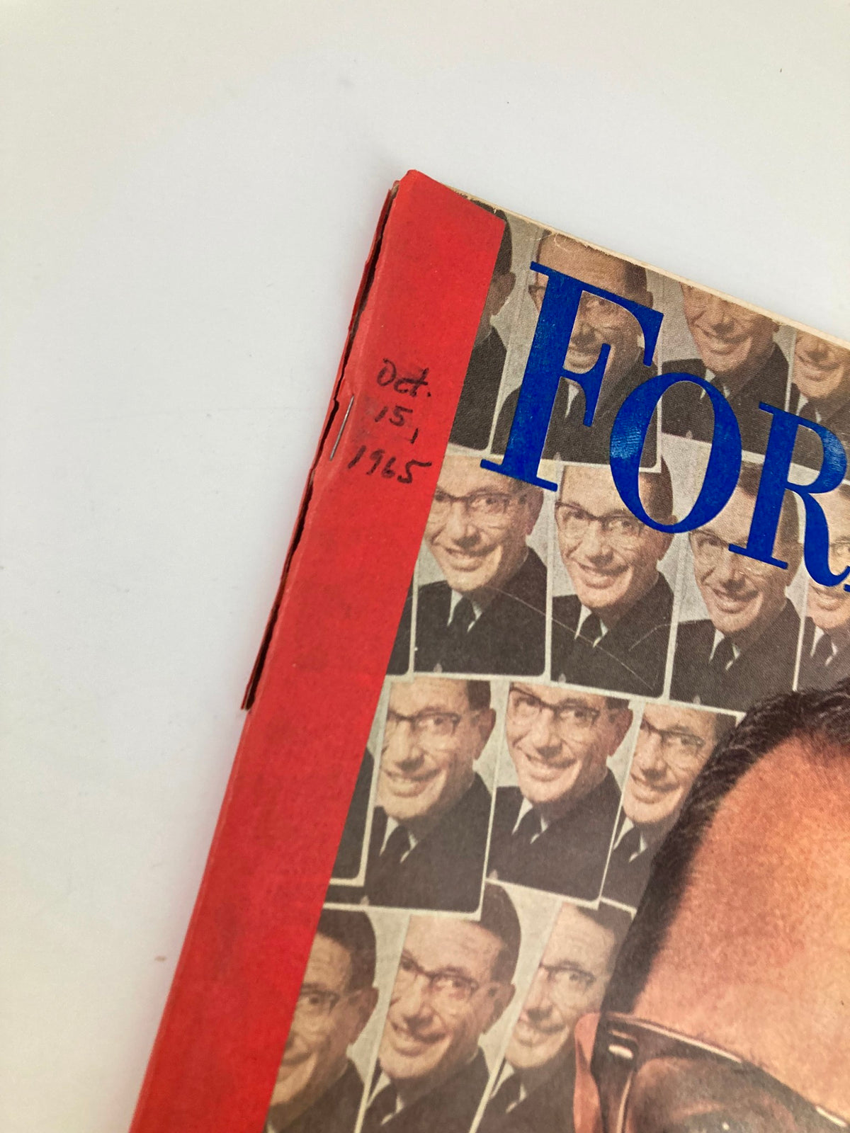 Close-up of the top corner of the vintage Forbes magazine dated October 15, 1965 highlighting the title and date.