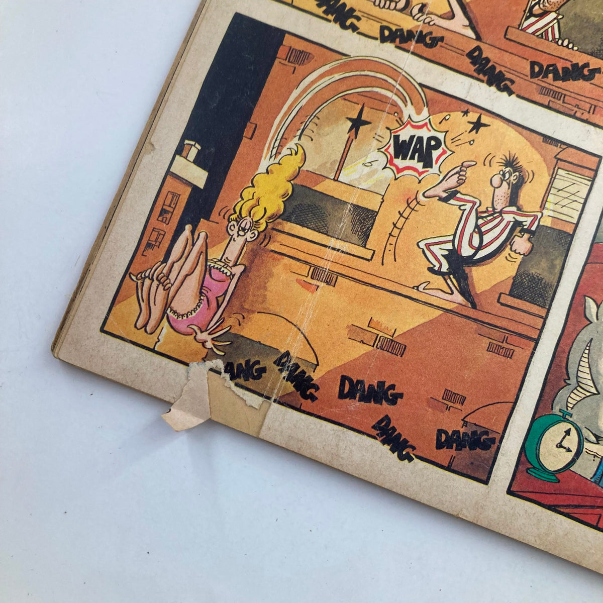 Close-up of a comic strip from Mad Magazine June 1980 No. 215 showing a character startled by a sound, showcasing the magazine's iconic satirical style.