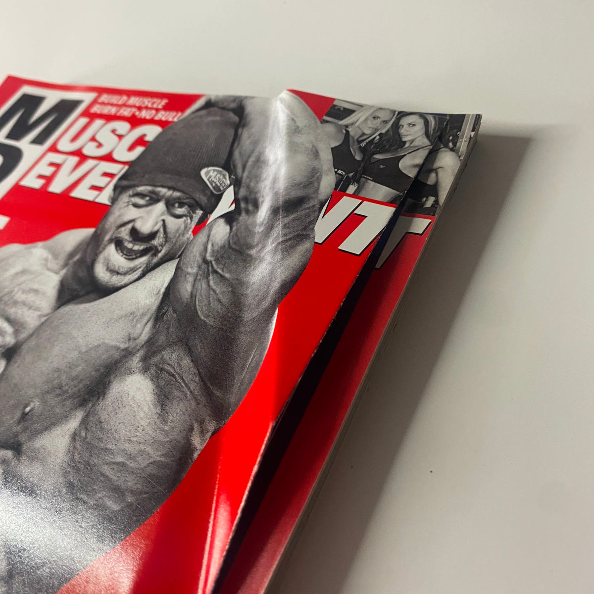 Close-up view of Muscular Development Magazine February 2010, Vol. 47 No. 2, highlighting spine and edge of the magazine, showing minor wear.