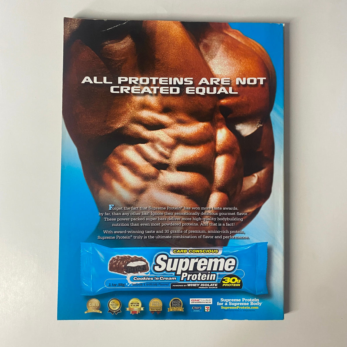 Back cover of Muscular Development Magazine October 2010, advertising Supreme Protein with a focus on muscle recovery and featuring a muscular physique. Highlights the importance of protein in bodybuilding.
