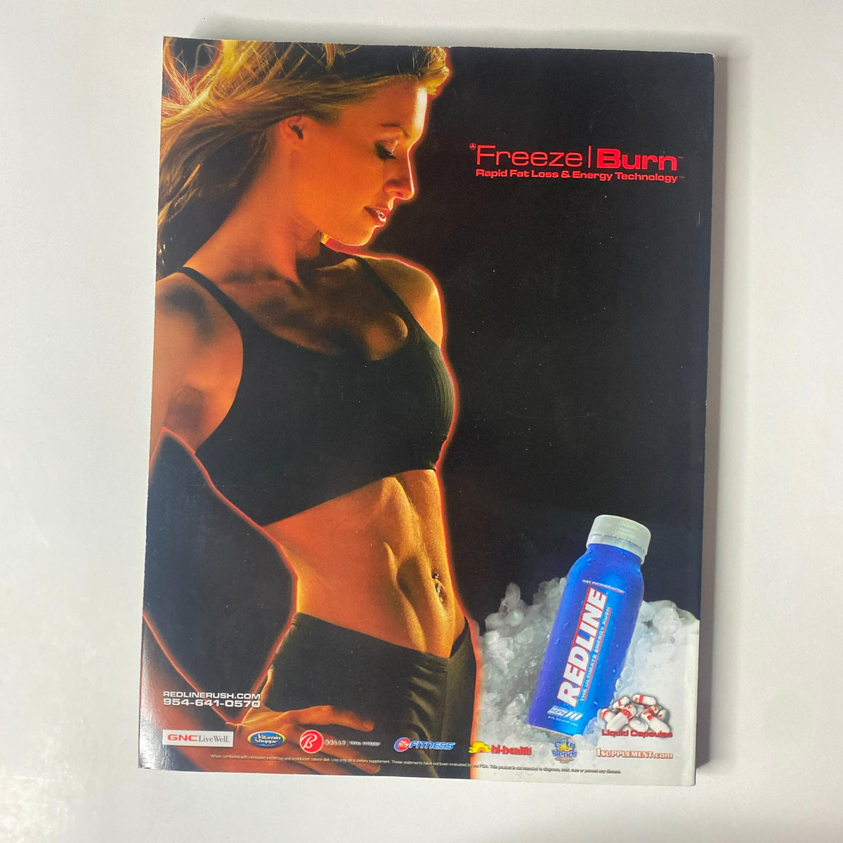 Back cover of Muscular Development Magazine May 2006, showcasing an advertisement for 'Freeze! Burn' rapid fat loss technology featuring a fit woman.