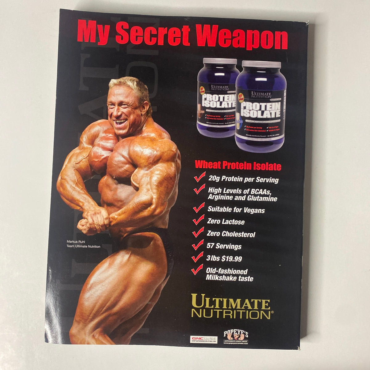 Muscular Development Magazine October 2008 advertisement for Ultimate Nutrition protein isolate featuring a muscular man promoting a health supplement, emphasizing its benefits for bodybuilding.