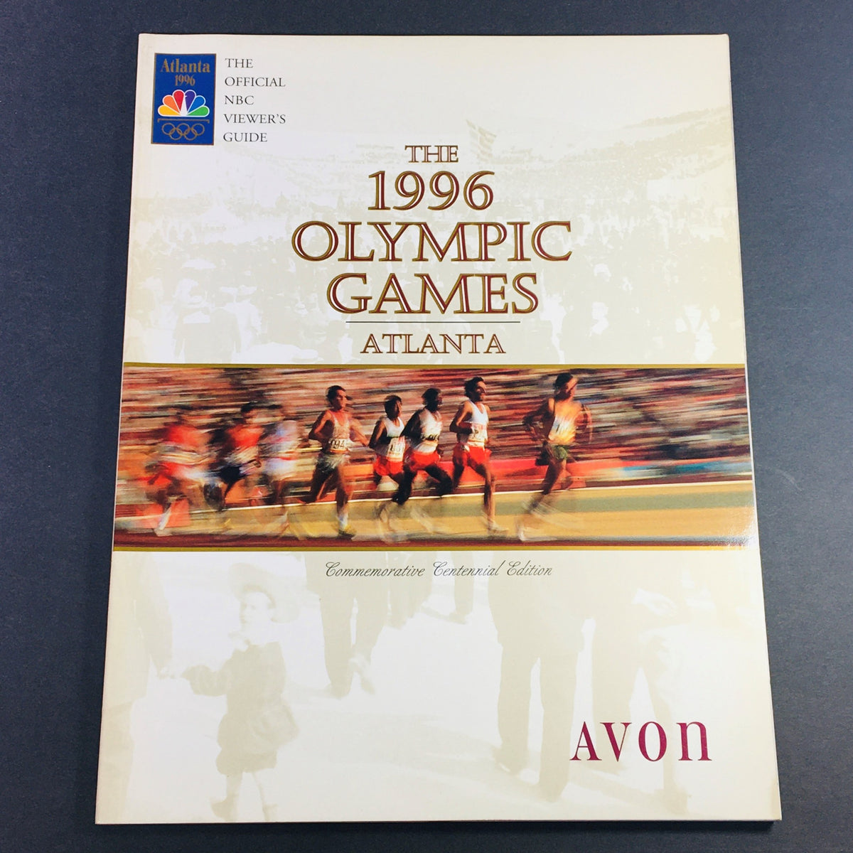 Cover of The 1996 Olympic Games Atlanta Viewer's Guide Commemorative Centennial Edition showcasing athletes in motion.