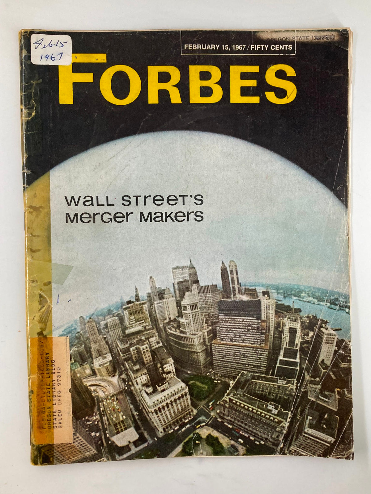 Cover of Forbes Magazine, February 15, 1967, titled 'Wall Street's Merger Makers', showing aerial view of city skyline.