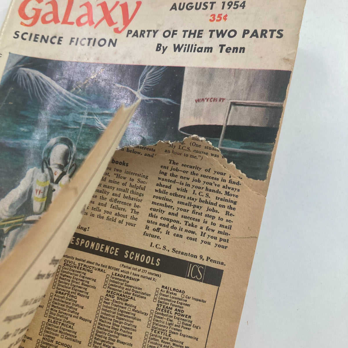 Inside view of Galaxy Science Fiction Magazine August 1954 showing the title 'Party of the Two Parts' by William Tenn, highlighting a notable rip on the cover and vintage advertisements.
