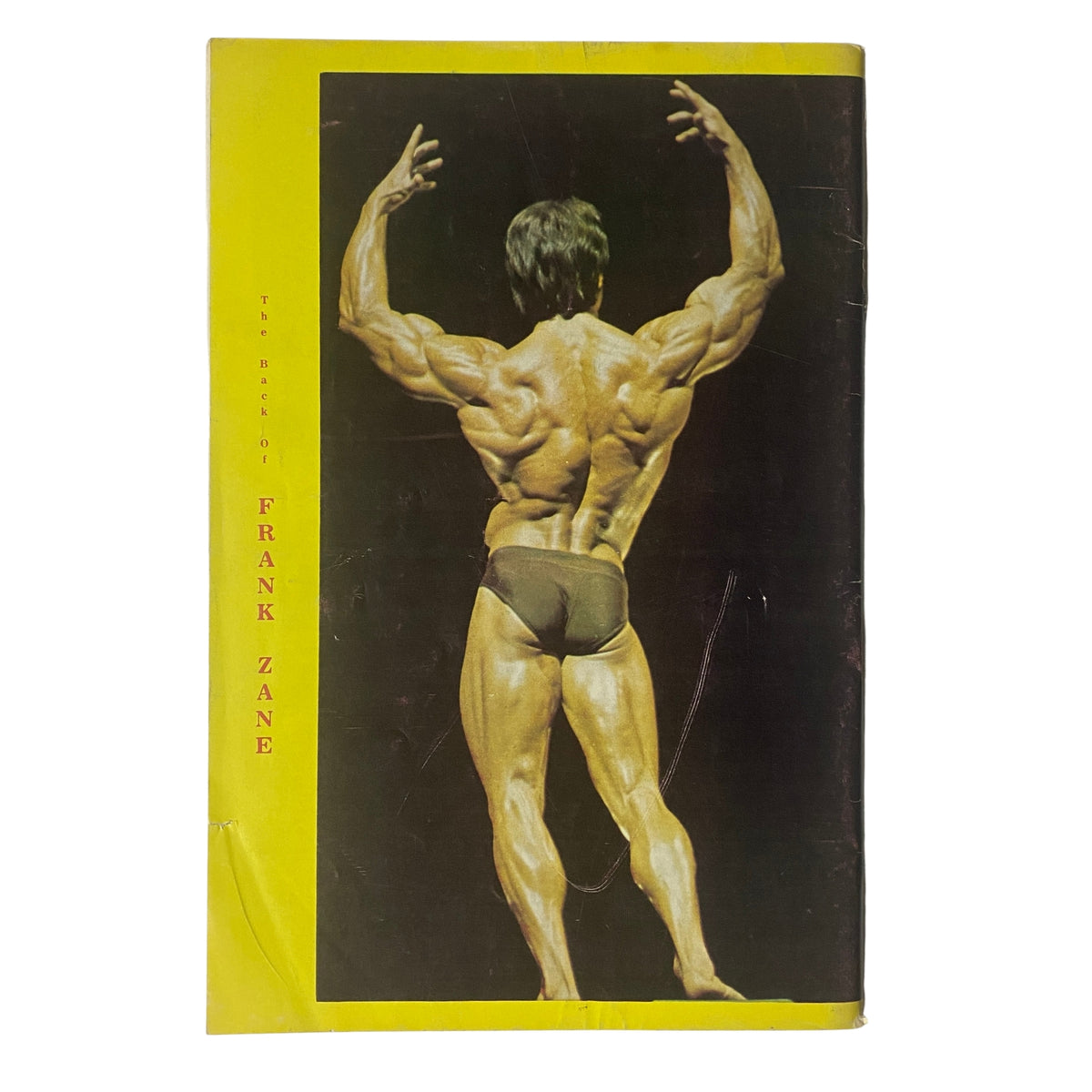 Back cover of IronMan Magazine July 1977 showcasing bodybuilder Frank Zane in a muscular pose.