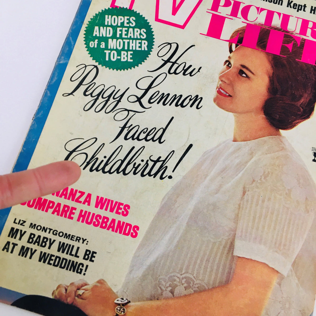 Close-up of the cover of TV Picture Life Magazine May 1965, highlighting the title 'How Peggy Lennon Faced Childbirth!' alongside text regarding 'Hopes and Fears of a Mother-to-Be'.