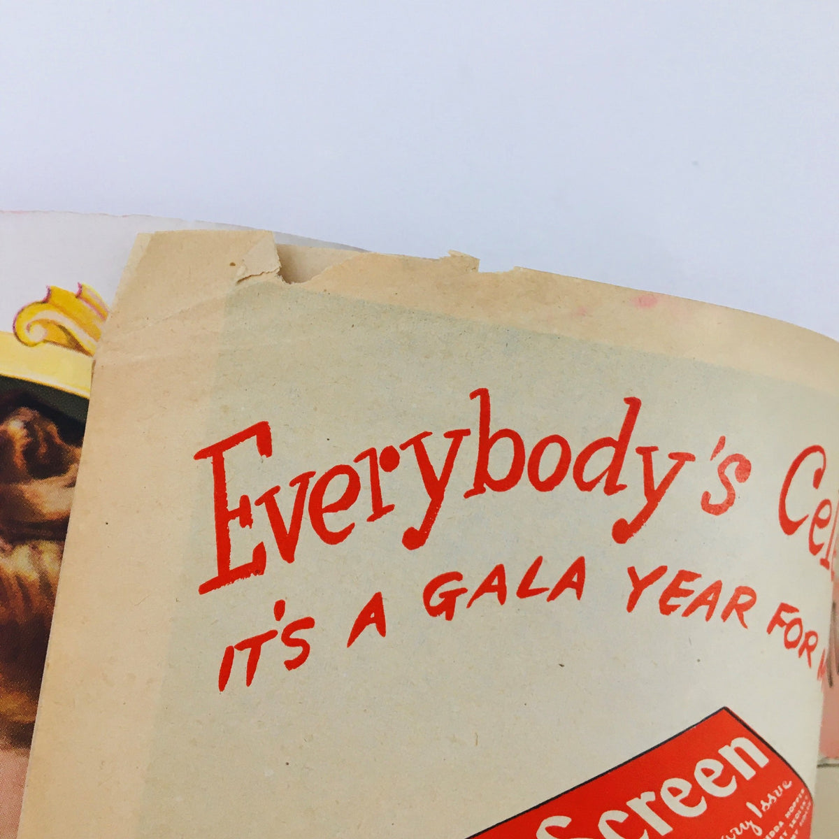 Inside spread of Modern Screen Magazine June 1945 showcasing an advertisement celebrating the anniversary with colorful design elements.