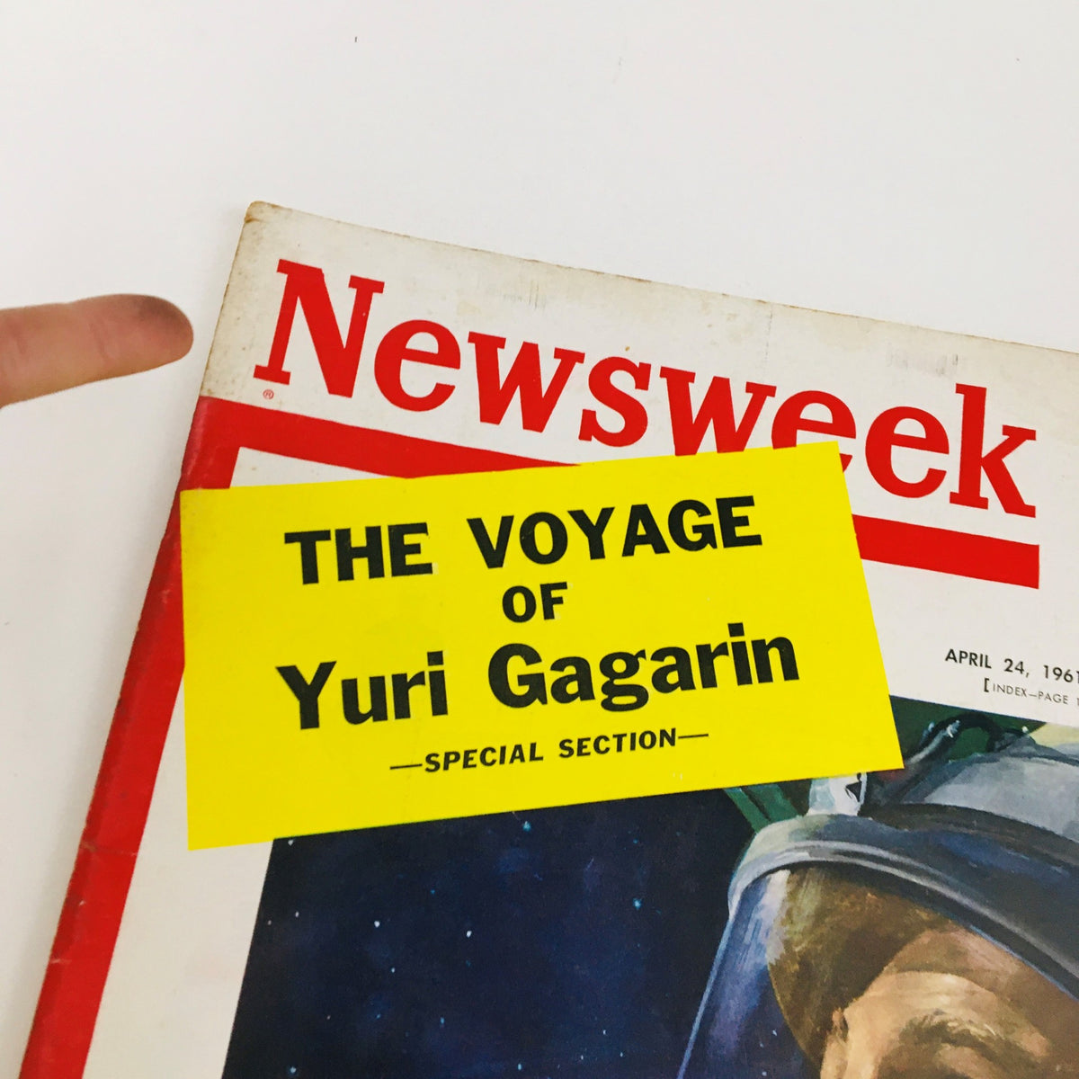 Close-up of the Newsweek Magazine April 24 1961 cover showcasing the yellow label 'The Voyage of Yuri Gagarin' special section, highlighting the historic space journey.