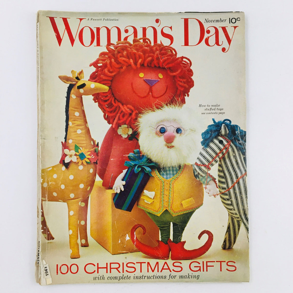 Cover of Woman's Day Magazine November 1961 featuring colorful stuffed animals and a festive theme for holiday gifting.