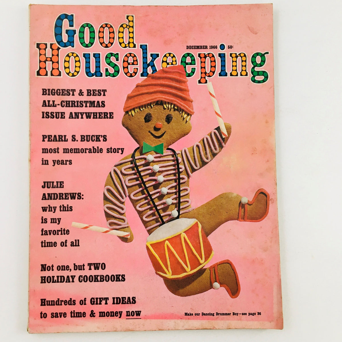 Cover of Good Housekeeping Magazine, December 1966, featuring a colorful illustration of a gingerbread boy playing a drum, highlighting articles on Pearl S. Buck and Julie Andrews, and promoting holiday cookbooks and gift ideas.