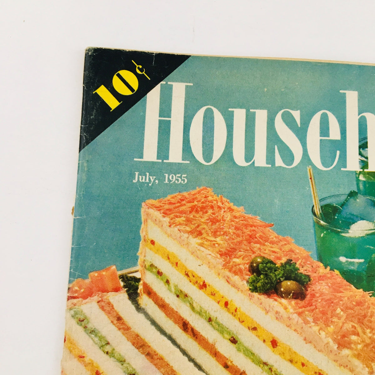 Detail of the cover of Household Magazine July 1955, showcasing a layered sandwich with vibrant ingredients.