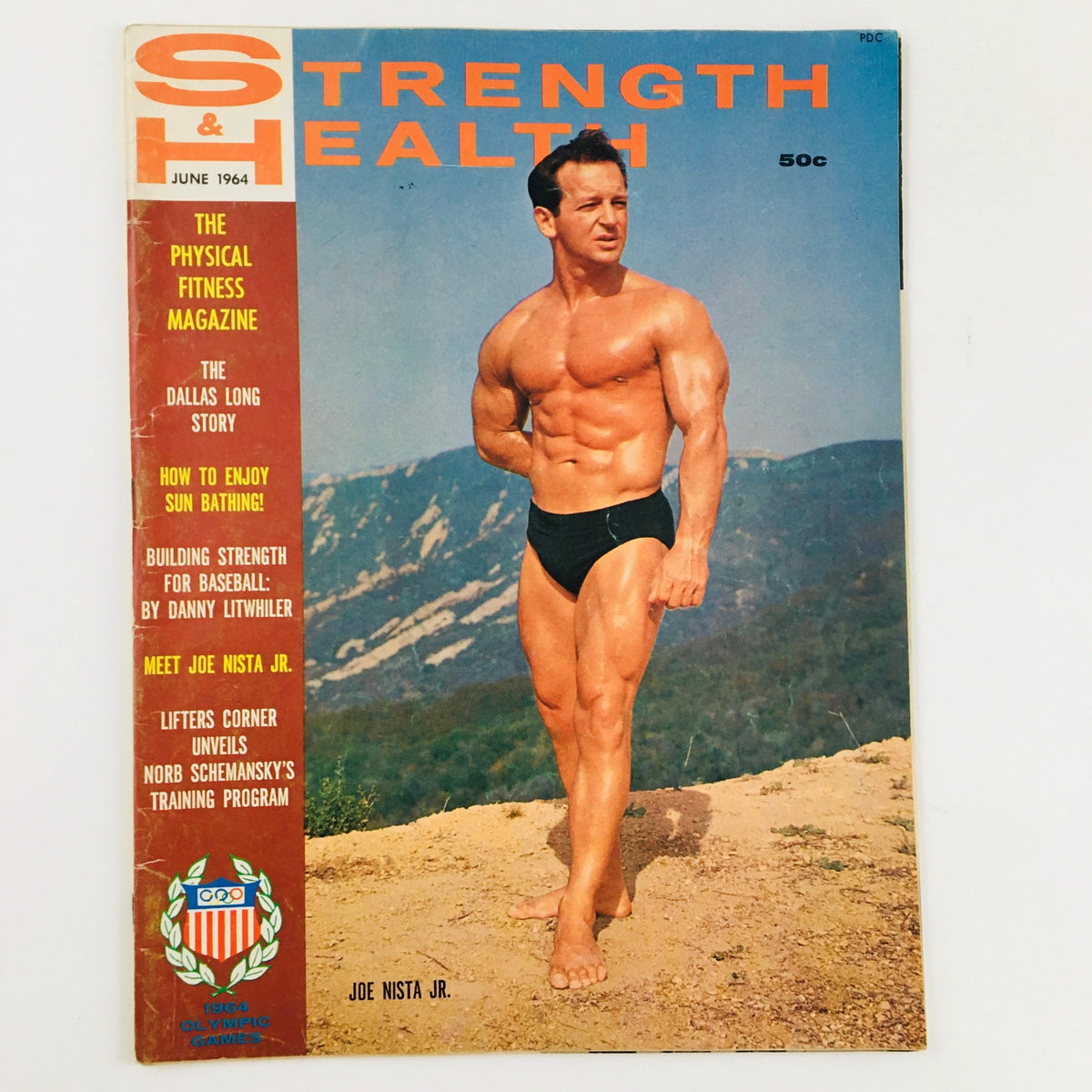 Cover of Strength & Health Magazine June 1964 featuring bodybuilder Joe Nista Jr. on a scenic mountain backdrop, showcasing fitness culture of the 1960s.