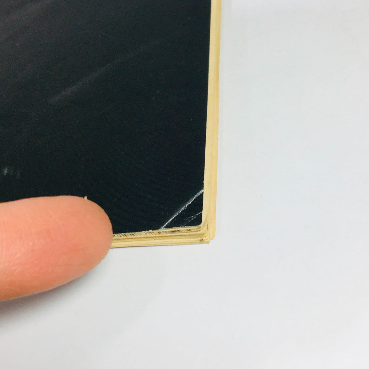 Close-up view of the edge of the June July 1976 issue of Modern Hi-Fi & Music, Volume 1003, highlighting minor wear and details, including a slight tear.