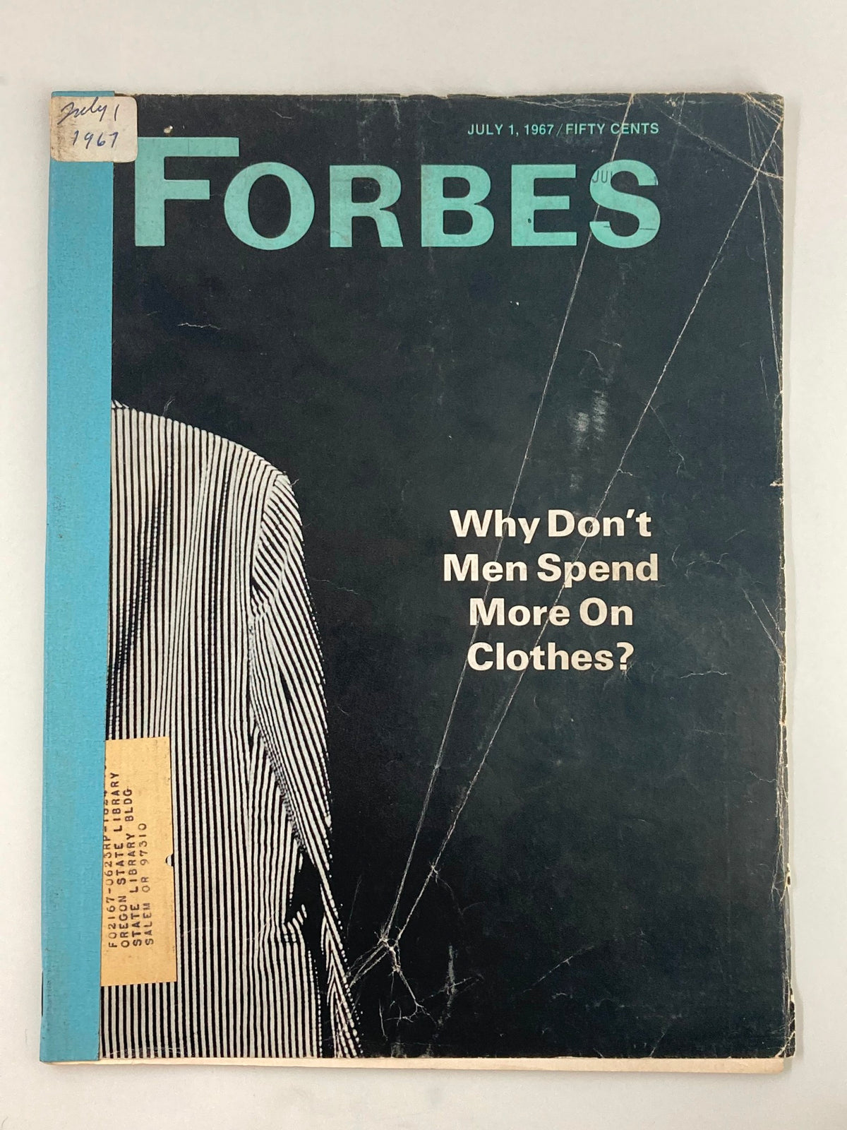 Cover of VTG Forbes Magazine July 1 1967 featuring the question 'Why Don't Men Spend More On Clothes?' with vintage design elements and a label on the corner.