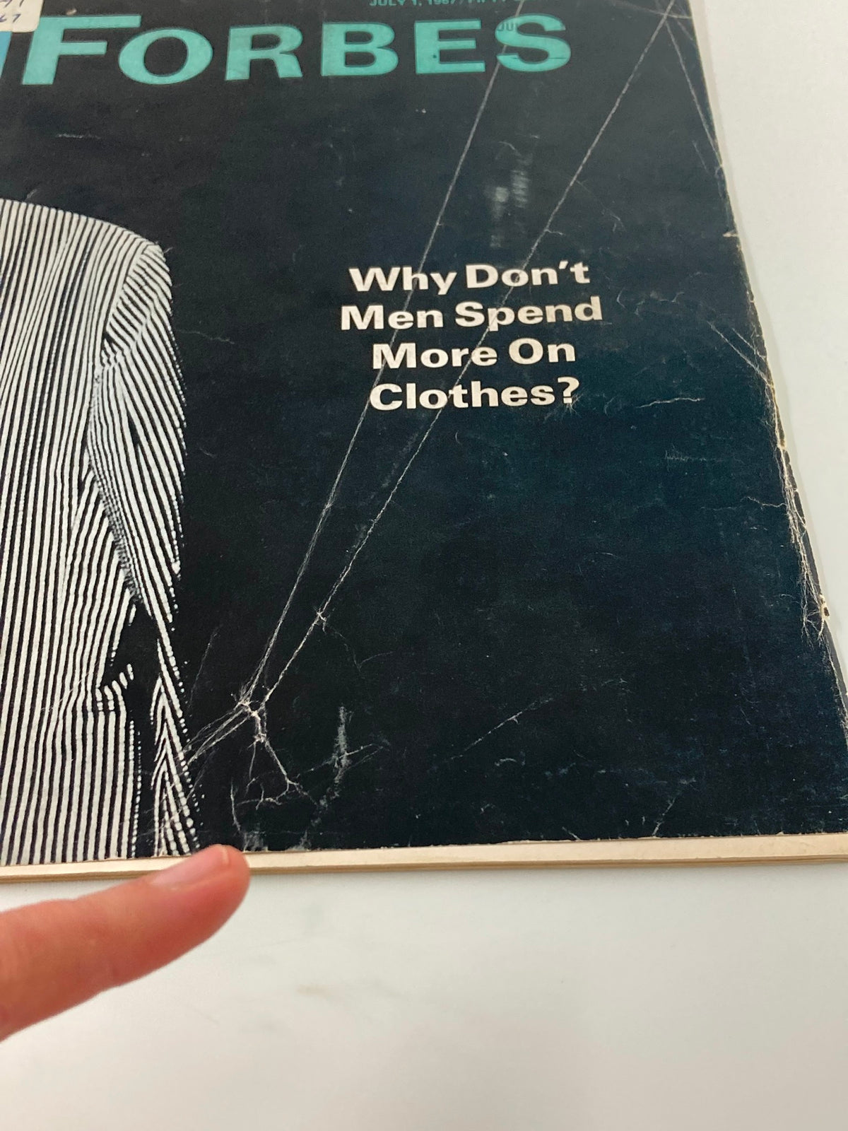 Detailed view of the cover of VTG Forbes Magazine July 1 1967 highlighting the question 'Why Don't Men Spend More On Clothes?' with visible wear signs.