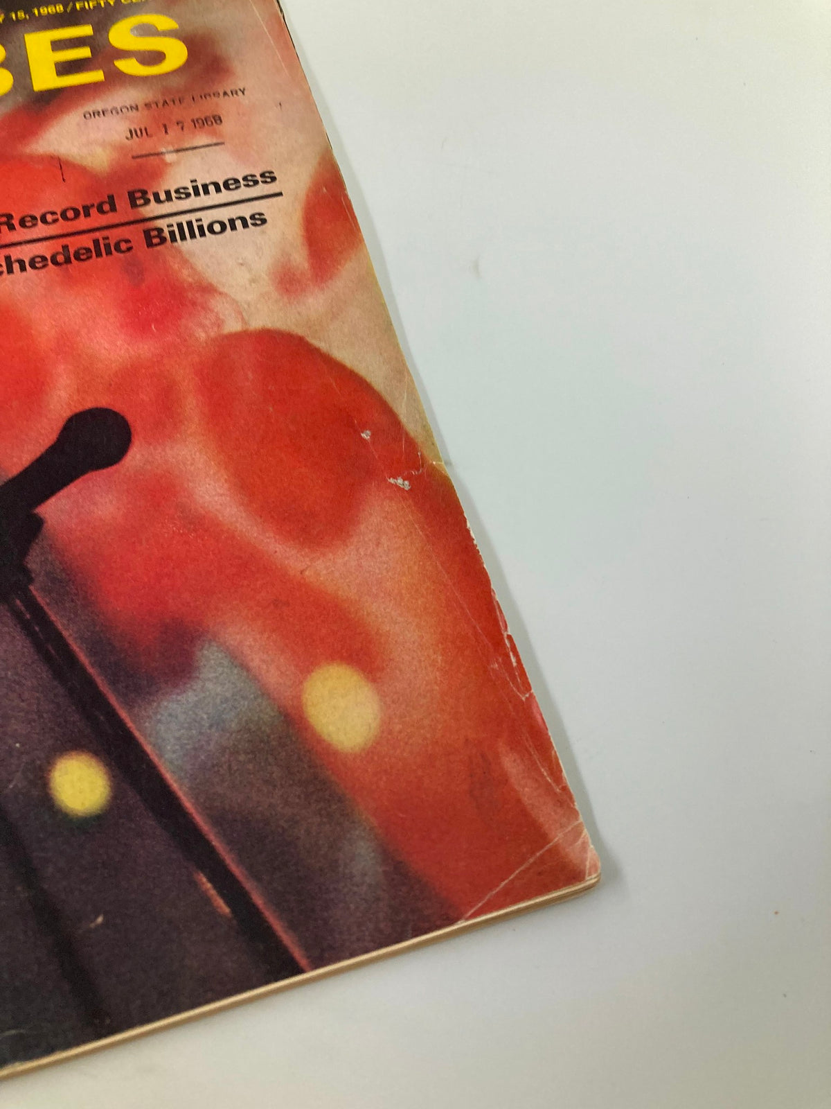 Close-up view of the cover of the vintage Forbes Magazine dated July 15, 1968, featuring the title "The Record Business: Psychedelic Billion" with vibrant background colors indicative of the era.
