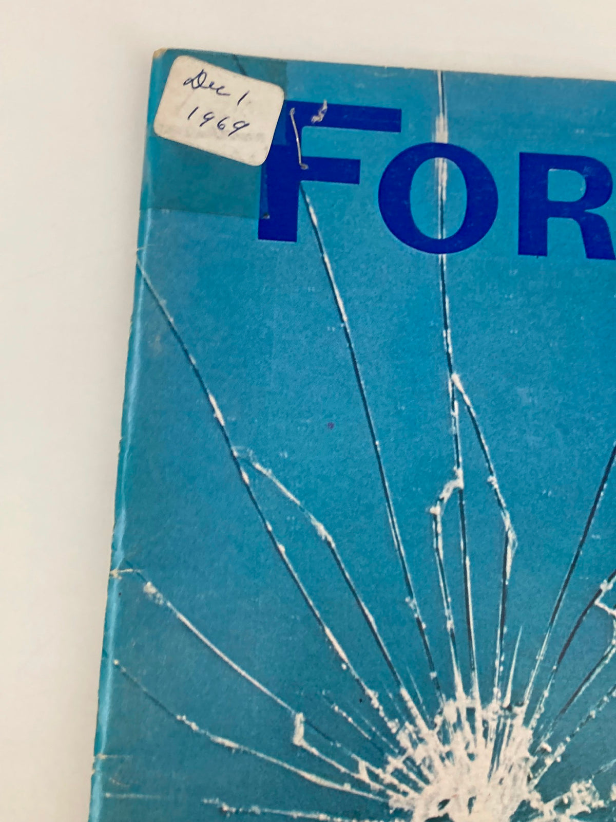 Close-up view of the top corner of the vintage Forbes Magazine from December 1, 1969, displaying the date and the title 'The Shattered Image of Litton Industries'.