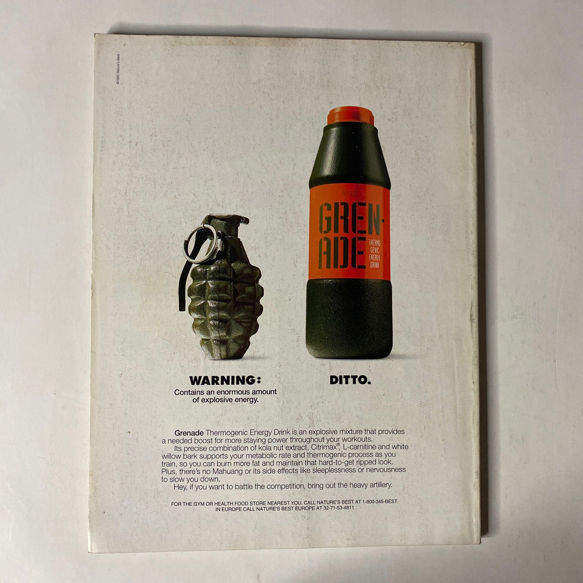 Back cover of IronMan Magazine June 1995 advertising Grenade Energy Drink, depicting an explosive grenade illustration alongside the drink.
