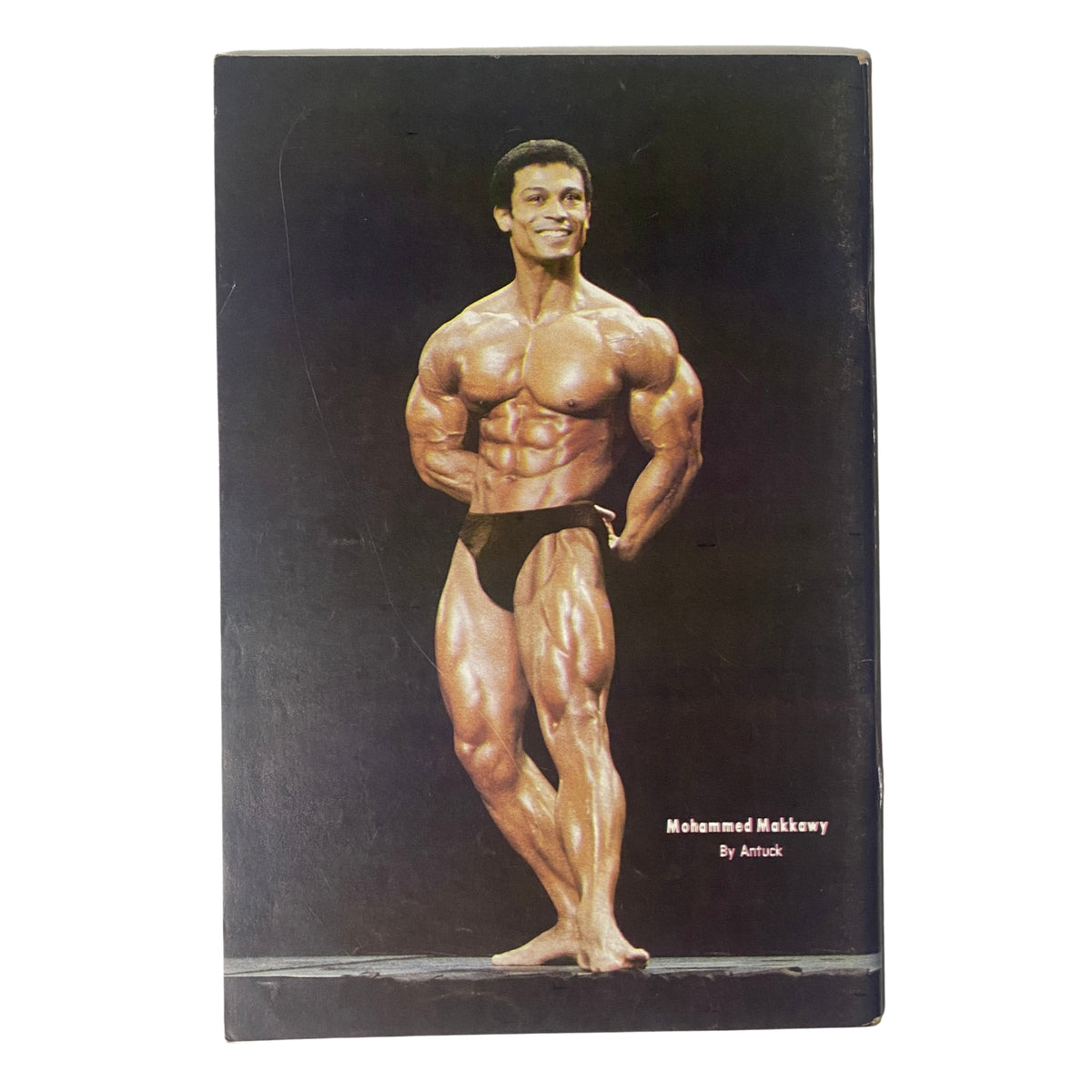 Back cover of IronMan Magazine, July 1982, featuring Mohammed Makkawy in a classic bodybuilding pose. Volume 41, Number 5.