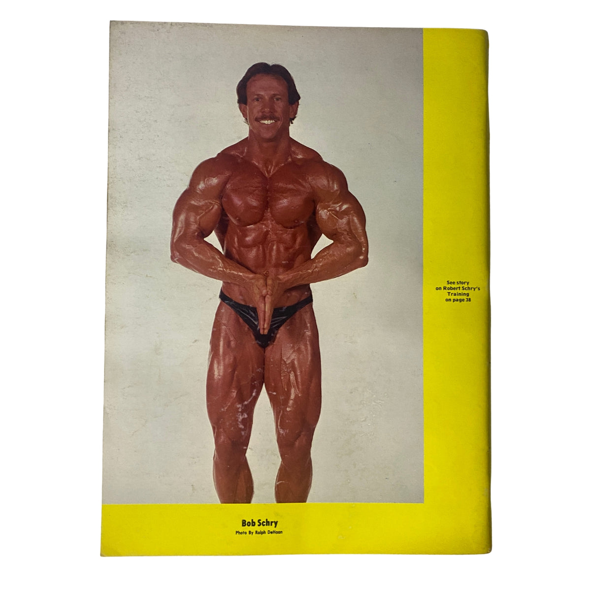 Back cover of IronMan Magazine July 1986 Vol 45 No. 5 featuring Bob Schry, a bodybuilder, posing prominently.