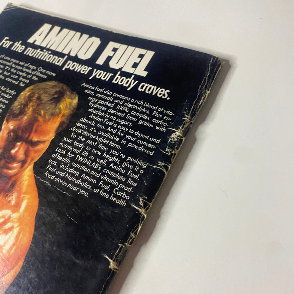Close-up of the Amino Fuel advertisement from IronMan Magazine May 1987 Vol 46 No. 4, emphasizing its benefits for muscle building and recovery.