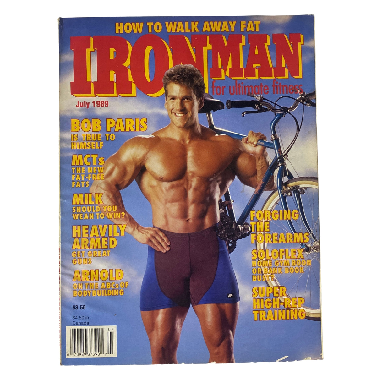 Cover of IronMan Magazine July 1989 Vol 48 No 7 featuring bodybuilder Bob Paris posing with a bicycle, highlighting fitness and nutrition themes with taglines about fat loss, bodybuilding tips, and contributions from Arnold Schwarzenegger.