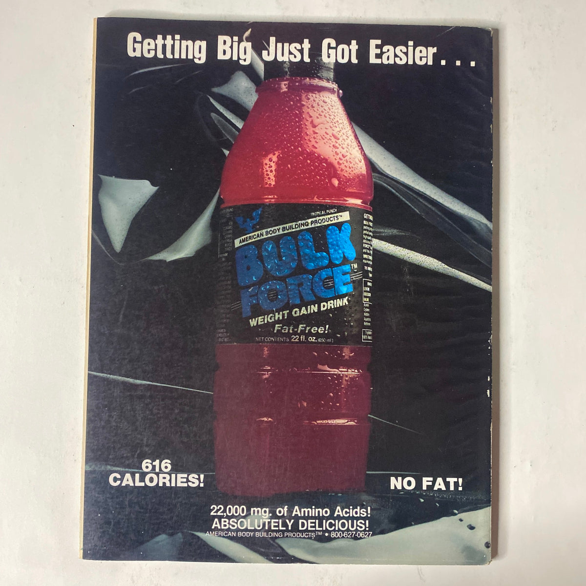 Back cover of IronMan Magazine February 1991 Vol 50 No 2 advertising a weight gain drink by American Bodybuilding Products, emphasizing its calorie content and nutritional benefits.