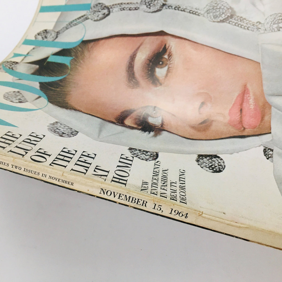 Cover of VTG Vogue Magazine from November 15, 1964, featuring the title 'The Lure of the Life at Home' with an artistic image and elegant typography.