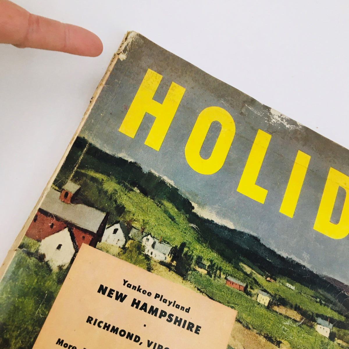 Close-up view of the top corner of the VTG Holiday Magazine September 1951, highlighting the title 'HOLIDAY' and visible wear on the cover.