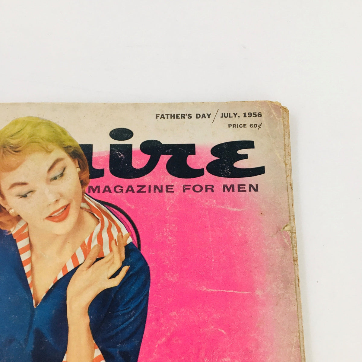 Detailed view of the cover art of VTG Esquire Magazine July 1956, highlighting the signature style and design typical of 1950s fashion magazines.