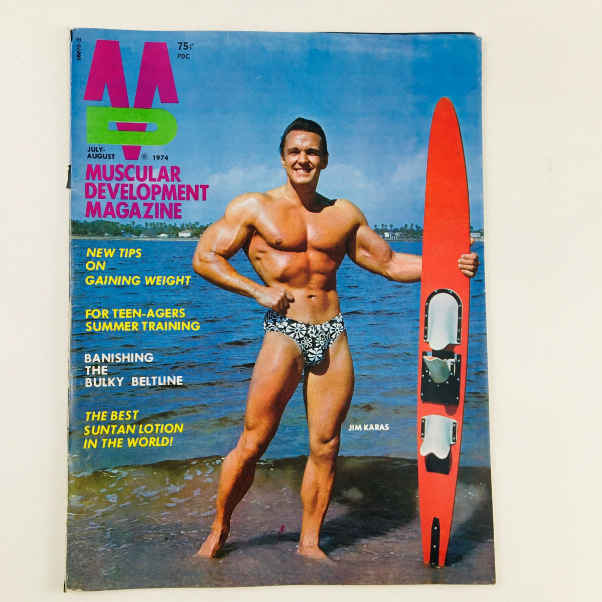 Cover of Muscular Development Magazine August 1974 featuring bodybuilder Jim Karas, showcasing fitness tips and bodybuilding culture from the 1970s.
