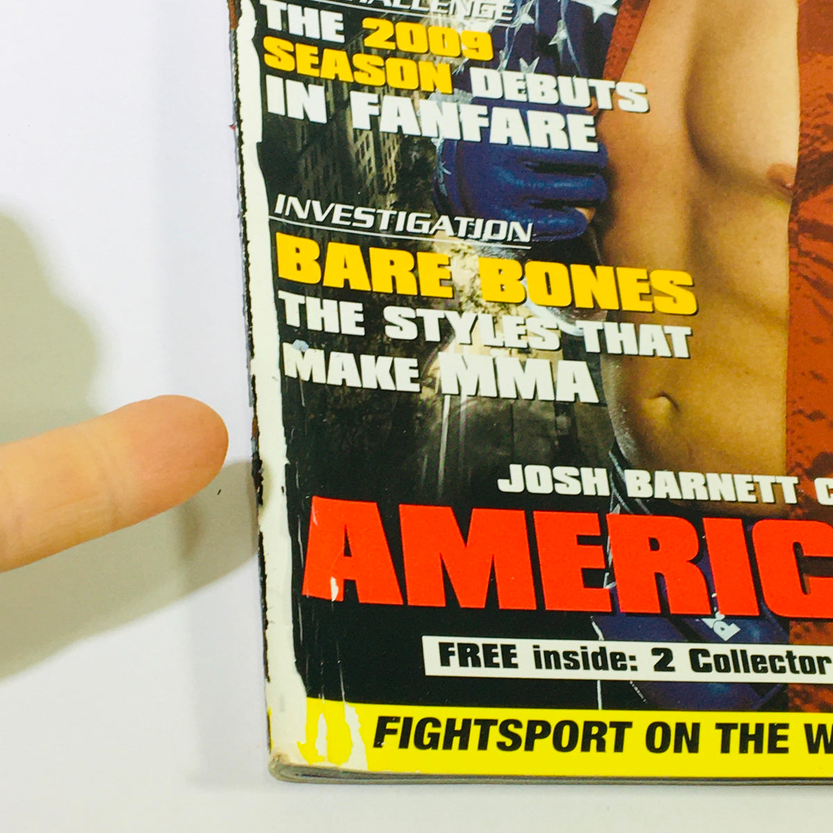 Close-up of Fight Sport Magazine May 2003 #17 showing hand pointing to the bold text 'AMERICAN HERO' referencing Josh Barnett within the context of MMA.
