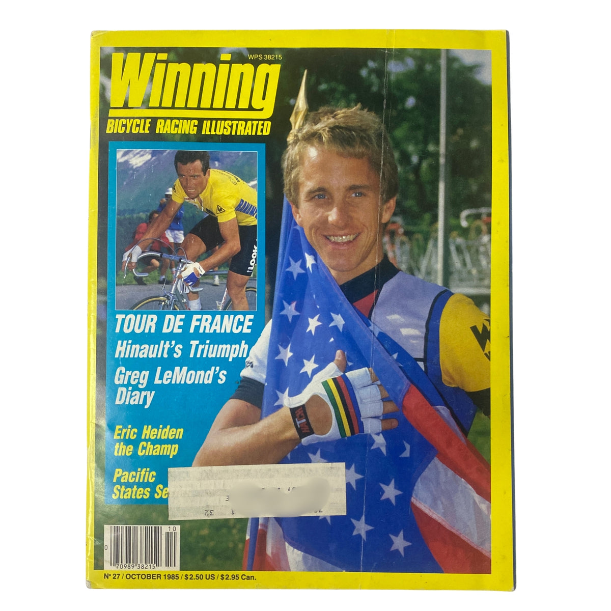 Front cover of Winning Bicycle Racing Illustrated, October 1985 issue featuring Greg LeMond celebrating with the American flag, highlighting the Tour de France and Bernard Hinault's triumph.