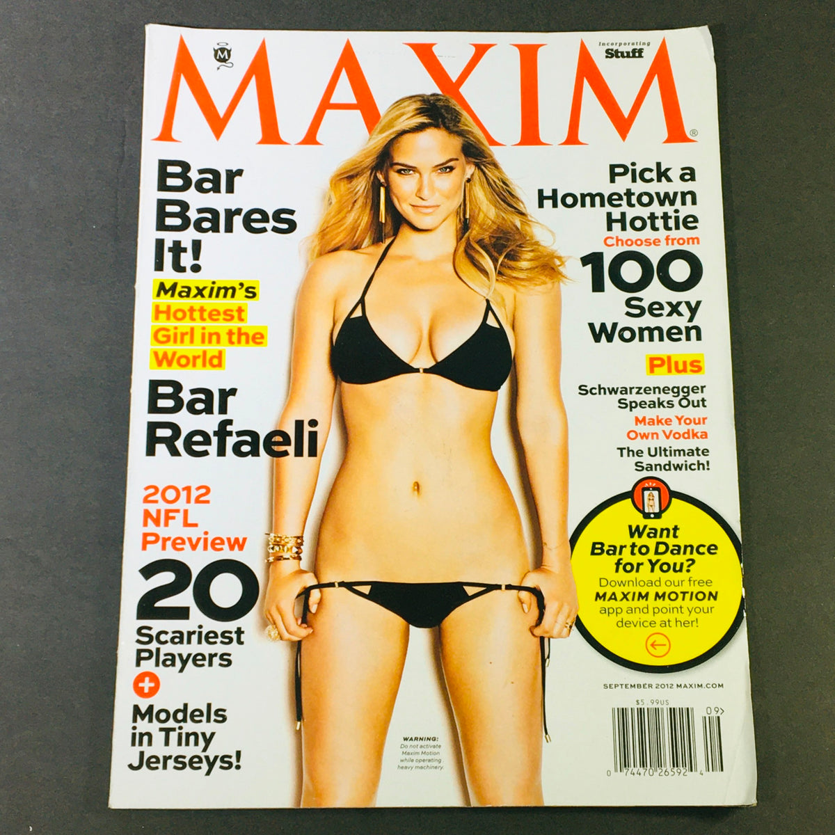 Maxim Magazine September 2012 featuring Bar Refaeli, crowned the "Hottest Girl in the World," on the cover, showcasing her in a black bikini.
