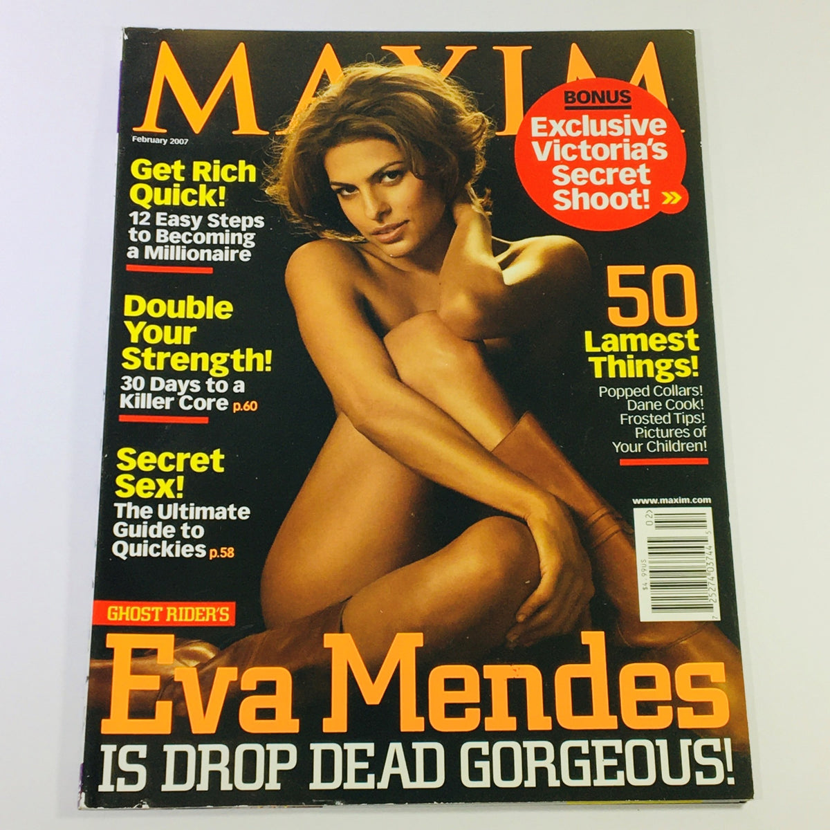 Maxim Magazine February 2007 cover featuring Eva Mendes, promoting a stunning visual with a headline that reads 'Eva Mendes is Drop Dead Gorgeous' and includes articles on wealth-building and fitness.