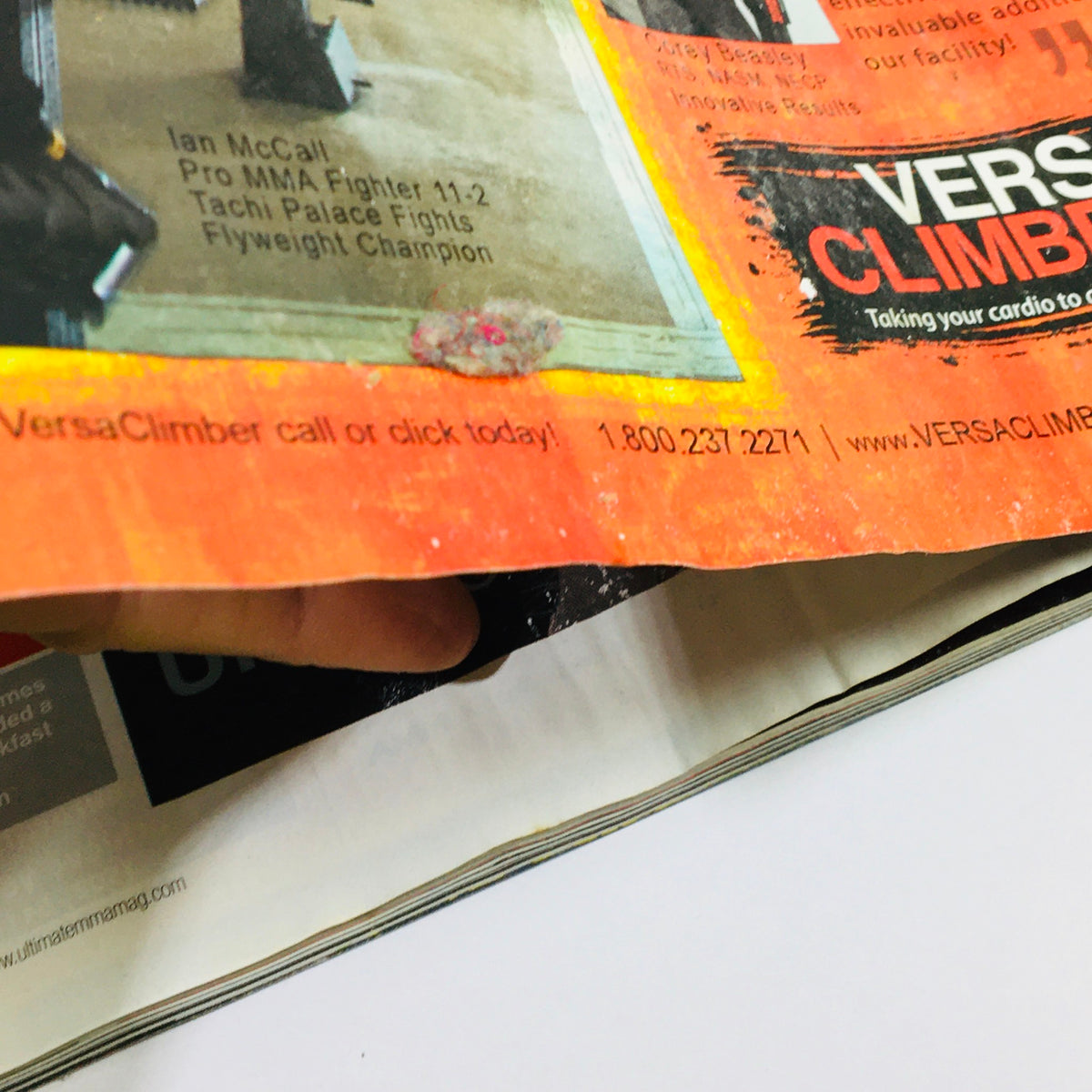 Inside page of Ultimate MMA Magazine December 2011 with an advertisement for VersaClimber, highlighting fitness equipment for MMA athletes.