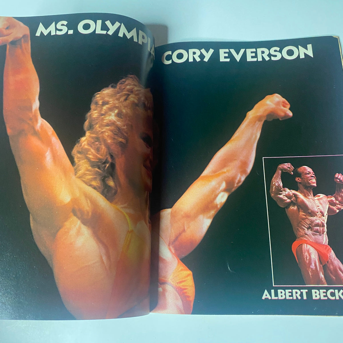Centerfold spread from Muscle & Bodybuilder Magazine Summer 1985 featuring Ms. Olympia Cory Everson and champion bodybuilder Albert Beck.