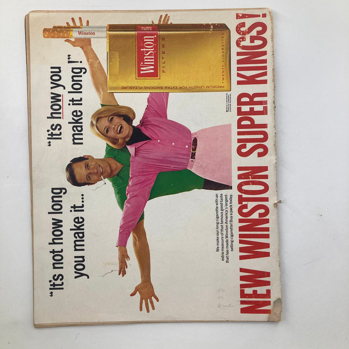 Vintage advertisement featuring a smiling couple promoting Winston Super Kings cigarettes, from the VTG Look Magazine August 22, 1967 Vol 31 No. 17 Moshe Dayan & Yael Dayan.