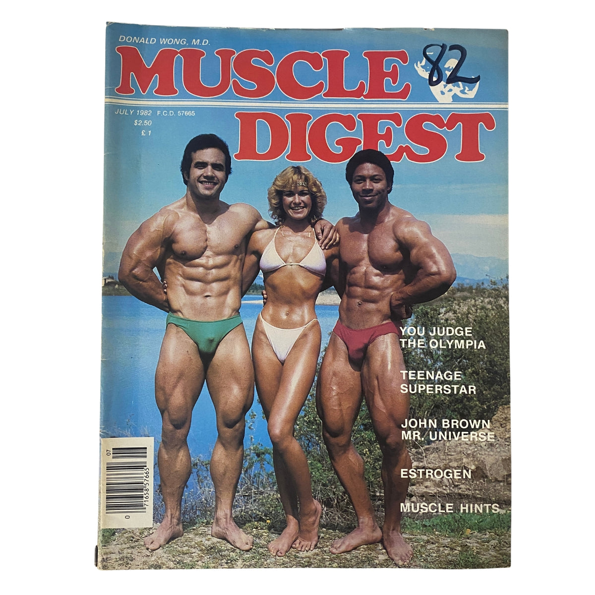 Cover of Muscle Digest Magazine July 1982 featuring Carlos Casa, Gina Marie, and Doyle Washington posing in swimsuits by a scenic lake.