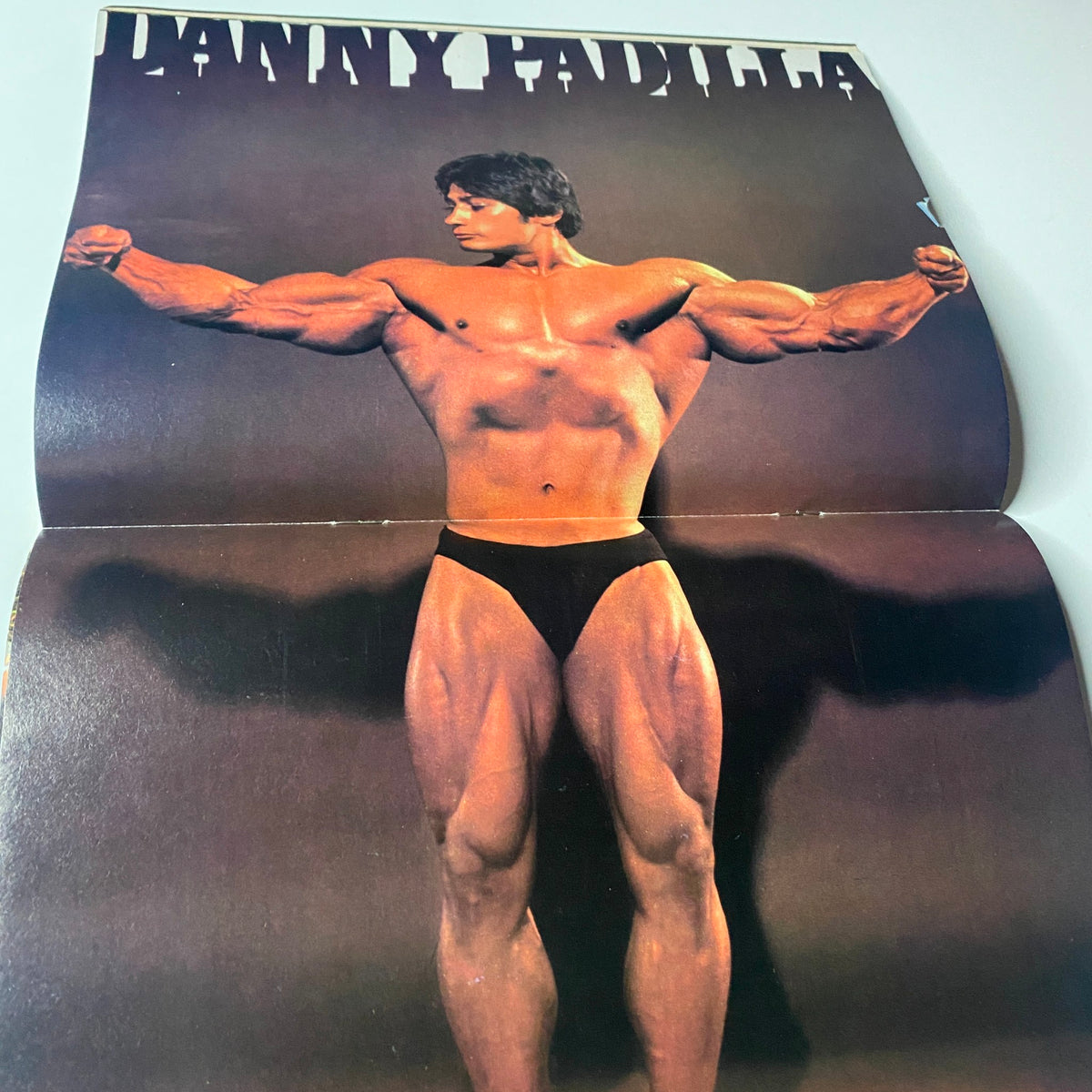 Muscle Digest Magazine December 1979 featuring Kalman Szkalak centerfold showcasing his muscular physique in a pose highlighting his biceps and legs, emphasizing fitness and bodybuilding.