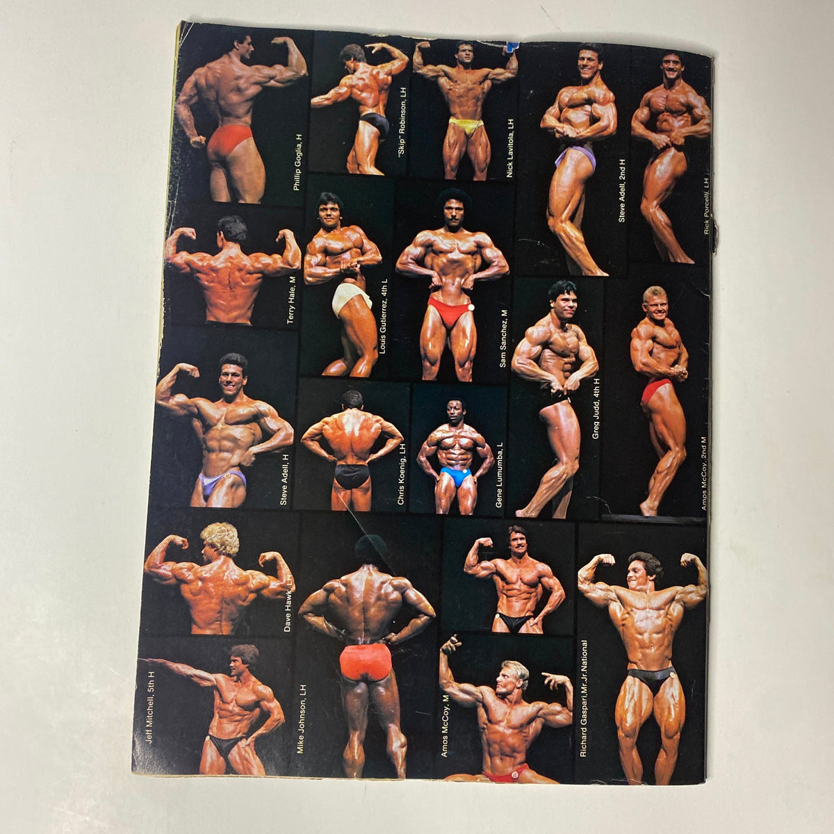 Back cover of Muscle Digest Magazine October 1983 featuring various bodybuilding competitors posing, celebrating the art of bodybuilding.